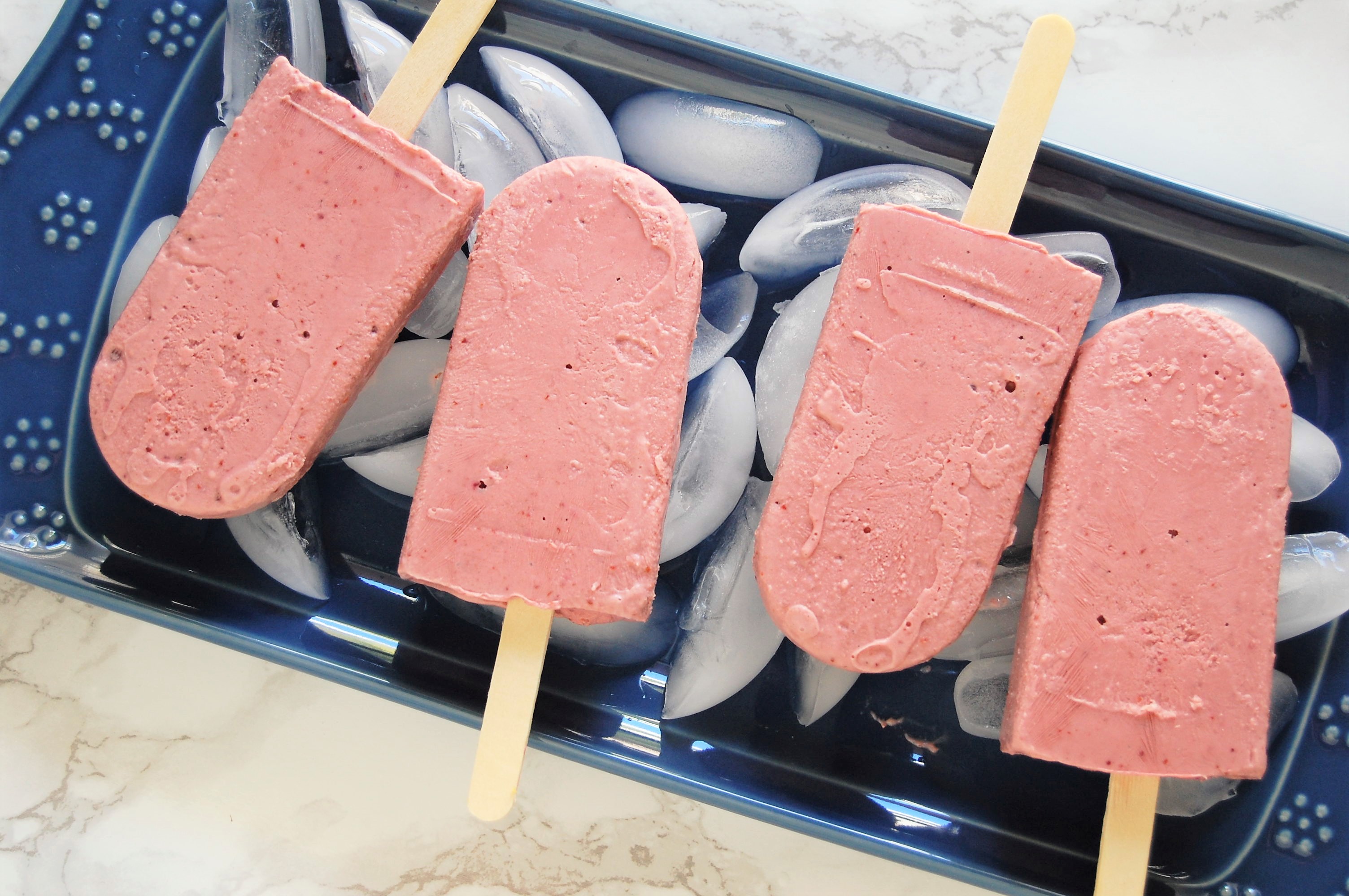 Cherry Cheesecake Protein Pops are a healthy treat recipe, easy to make with just four ingredients! This is a refreshing treat packed with fruit and protein, perfect for the whole family this summertime! | recipe, healthy recipe, healthy dessert, protein dessert, easy recipe, cherries, cheesecake, popsicle, nutrition, dietitian |