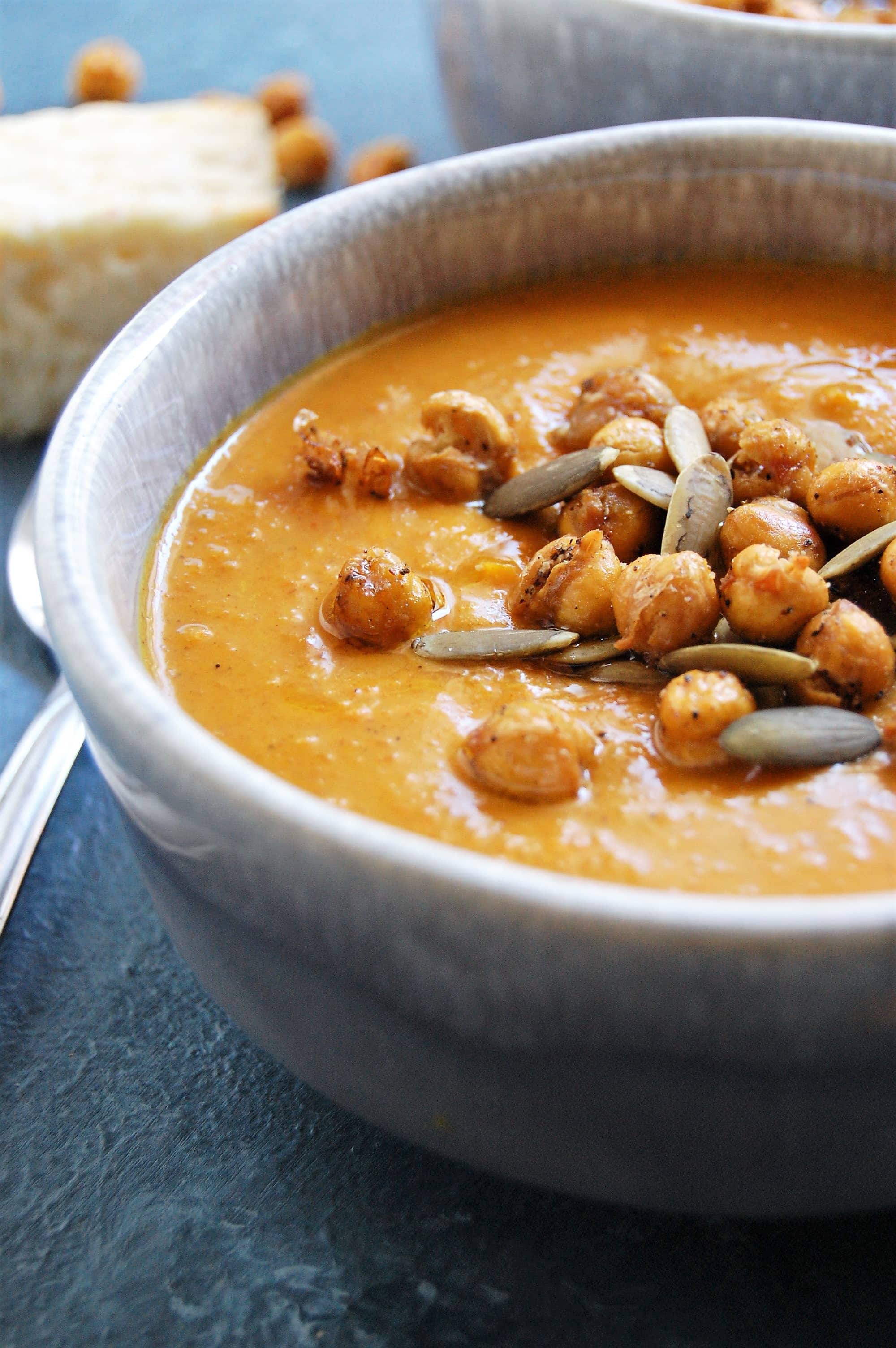 This easy Spiced Sweet Potato Carrot Soup is a delicious, vegan harvest soup. It's packed with flavorful, warm spices and is gluten and dairy-free. 