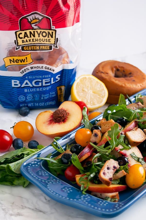 Blueberry Panzanella on a long blue plate with Canyon Bakehouse Gluten Free Blueberry Bagels