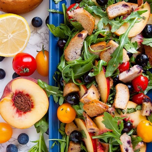 Canyon Bakehouse Gluten Free Blueberry Bagel Blueberry Panzanella Salad with fresh fruit on the side.