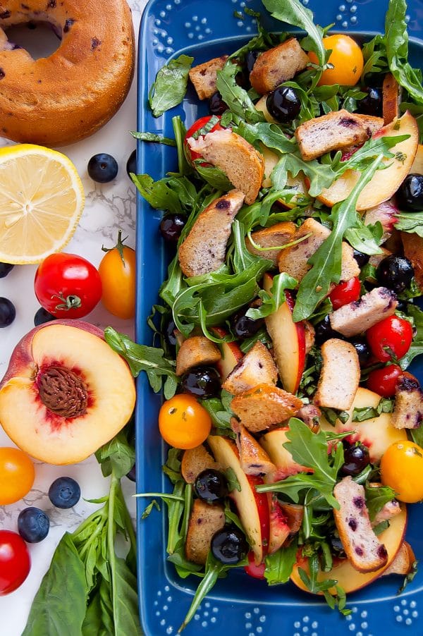 Canyon Bakehouse Gluten Free Blueberry Bagel Blueberry Panzanella Salad with fresh fruit on the side.