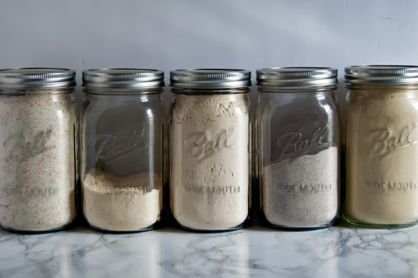 Storing gluten-free flours in large mason jars is an easy, clean way to spring clean your kitchen.