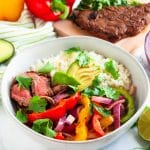 Grilled steak fajitas veggie bowls are an easy, healthy dinner recipe that's light and full of veggies! | #glutenfree #whole30 #healthydinnerrecipes #healthygrilling| nutritiontofit.com
