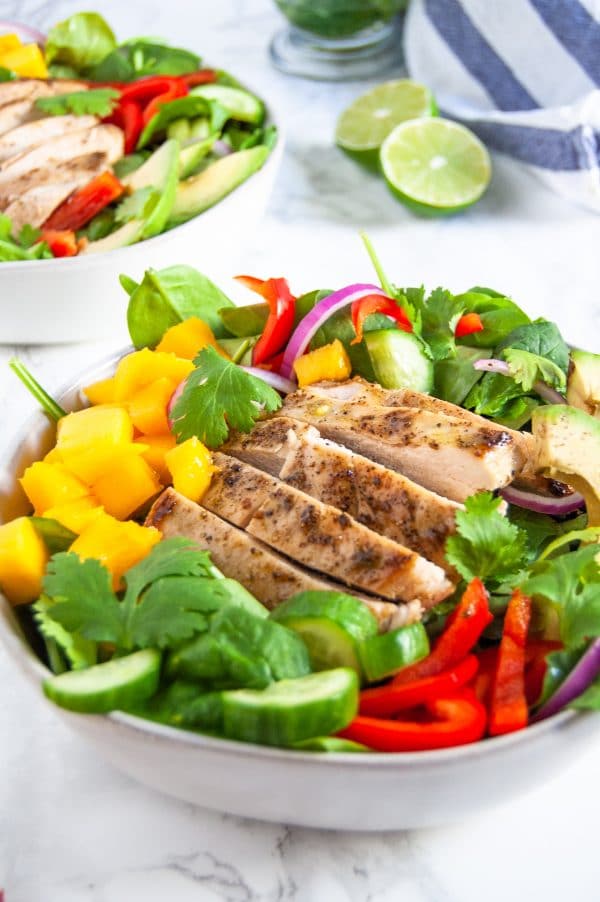 This mango chicken salad with cilantro lime dressing is a fresh and flavorful salad perfect to keep you energized in warmer months. Naturally gluten-free and dairy-free, this mango chicken salad is full of protein, fiber, vitamin A, vitamin C, and antioxidants.