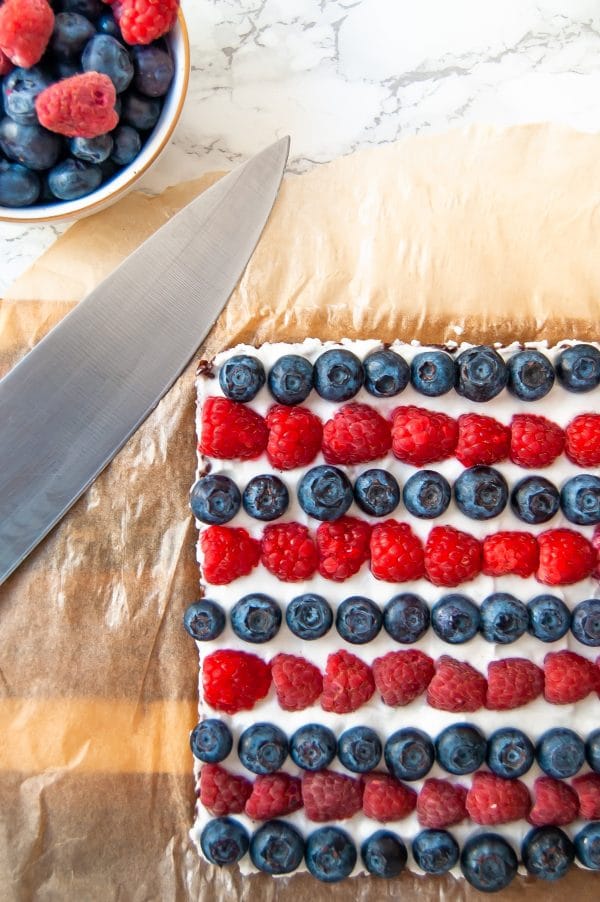 A delicious, no-bake fruit pizza recipe that's made with simple, fresh ingredients. It's a perfect summer dessert that's easy to make, too!