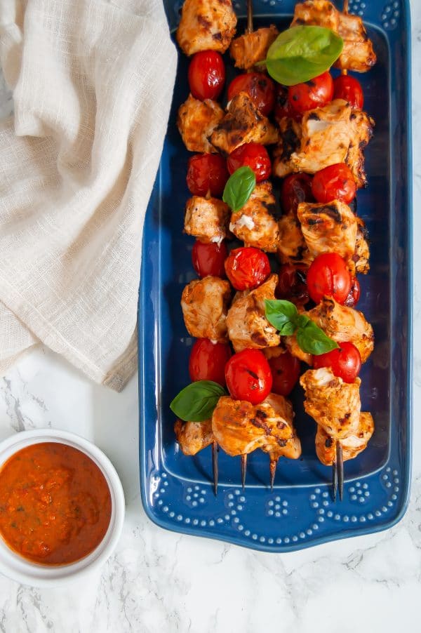 Tomato basil chicken kabobs make an easy, healthy chicken kabob recipe with a simple, flavorful tomato basil marinade. These tomato basil chicken kabobs are perfect for fresh summer grilling!