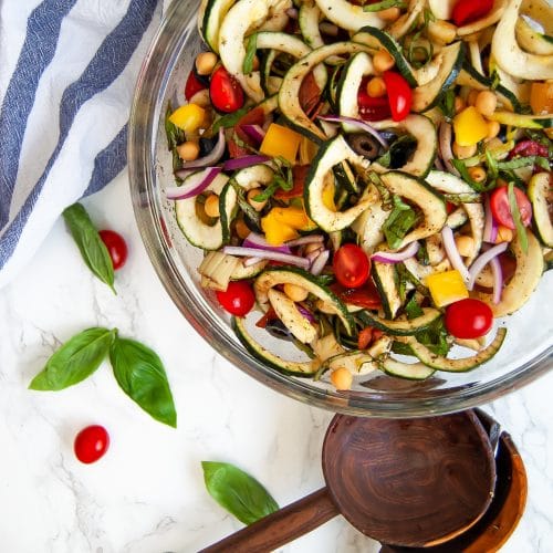 Antipasto salad gets a light and fresh take with this zucchini noodle antipasto salad. A fun zucchini noodle pasta salad, it's perfect with any healthy summer meal.