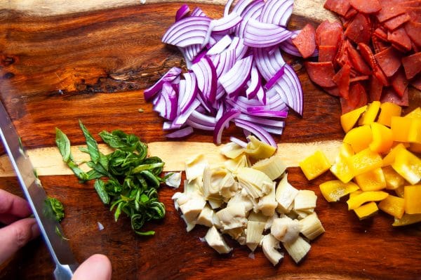 Antipasto salad gets a light and fresh take with this zucchini noodle antipasto salad. A fun zucchini noodle pasta salad, it's perfect with any healthy summer meal.