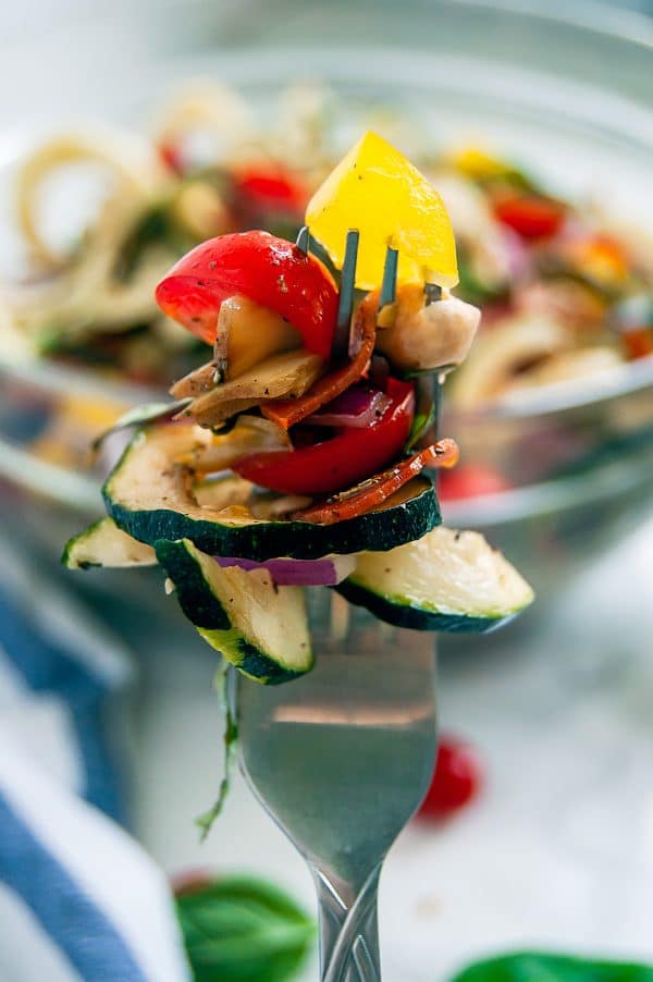 Antipasto salad gets a light and fresh take with this zucchini noodle antipasto salad. A fun zucchini noodle pasta salad, it's perfect with any healthy summer meal.