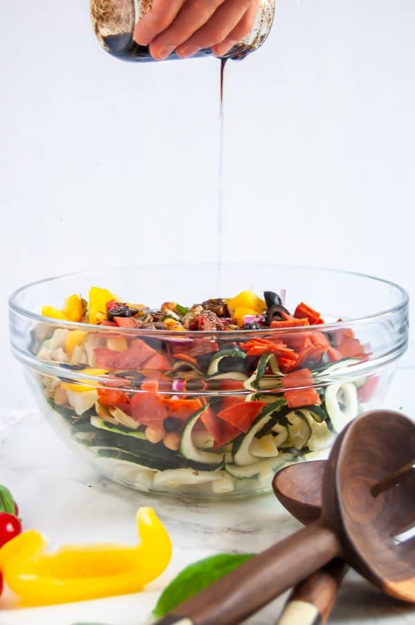 Antipasto salad gets a light and fresh take with this zucchini noodle antipasto salad. A fun zucchini noodle pasta salad, it's perfect with any healthy summer meal.