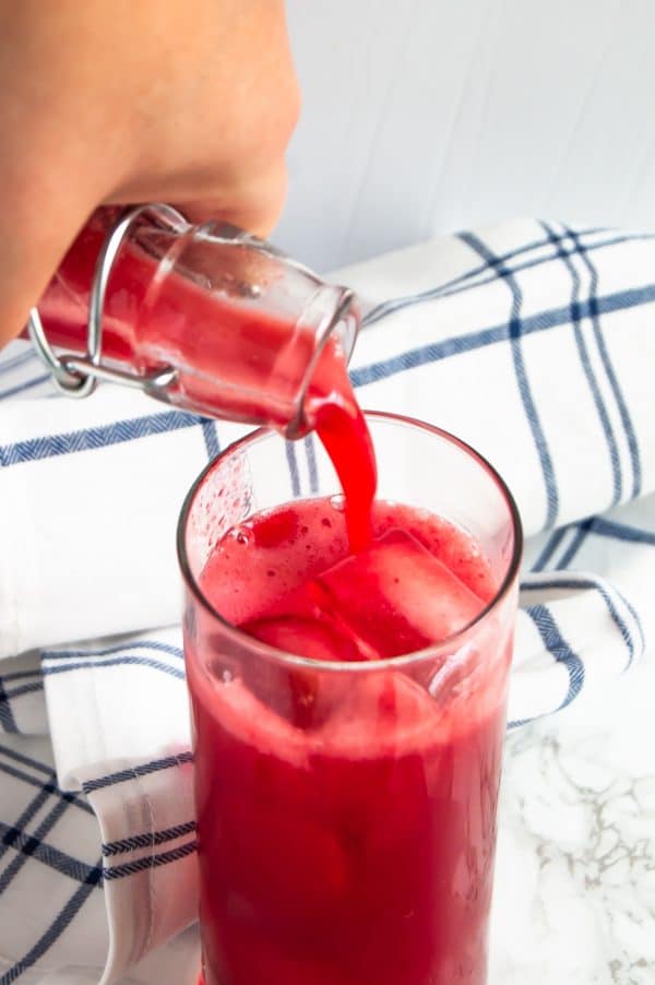 This sparkling berry cherry limeade is a refreshing, low-sugar drink that's easy to make at home with a few simple, real food ingredients.