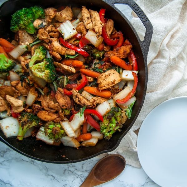 Easy chicken stir fry with garlic ginger sauce is a simple, healthy meal that can be made on a busy weeknight or easily added to your meal prep rotation.