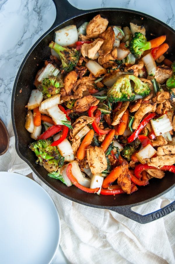 Easy chicken stir fry with garlic ginger sauce is a simple, healthy meal that can be made on a busy weeknight or easily added to your meal prep rotation.