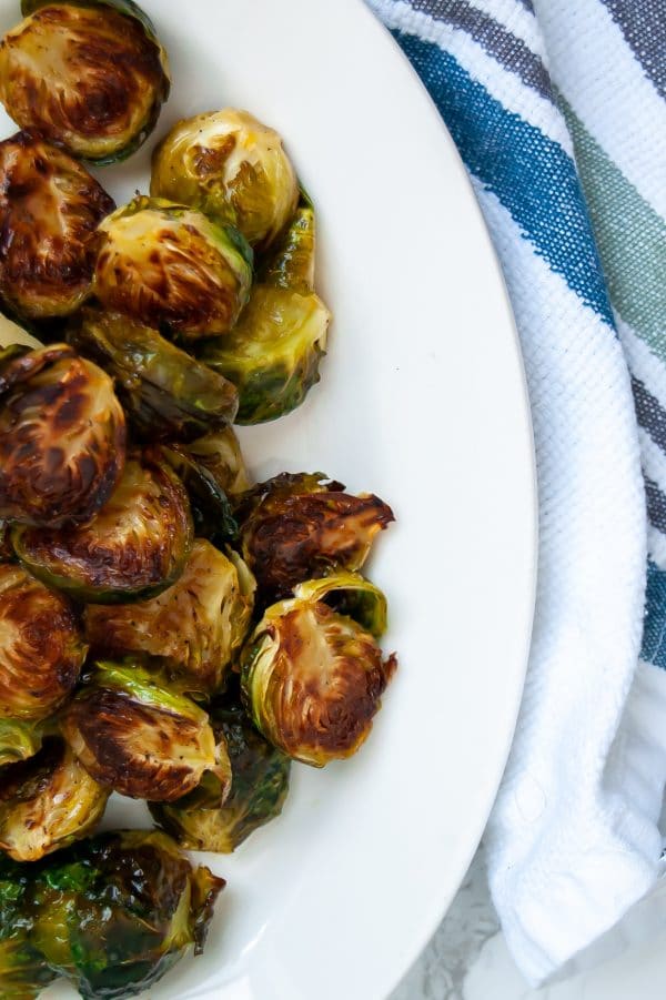 Maple dijon brussels sprouts are your answer to add flavor to easy roasted brussels sprouts. Try this easy, healthy side dish recipe today!