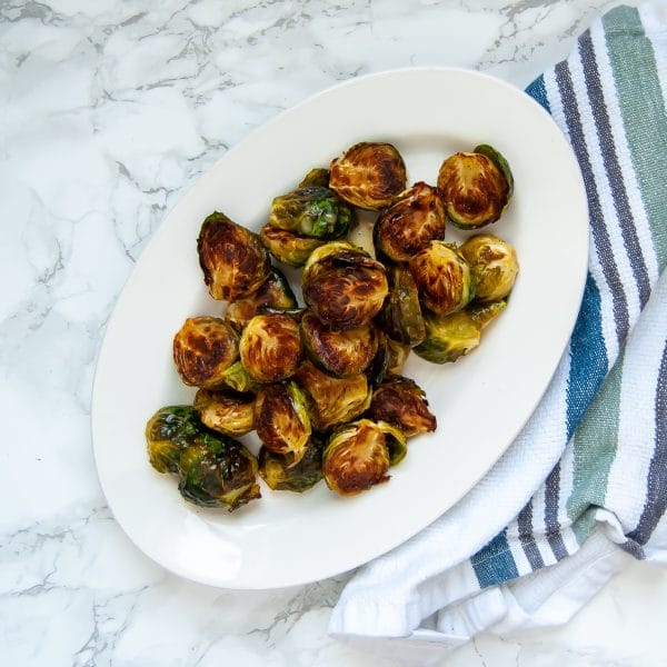 Maple dijon brussels sprouts are your answer to add flavor to easy roasted brussels sprouts. Try this easy, healthy side dish recipe today!