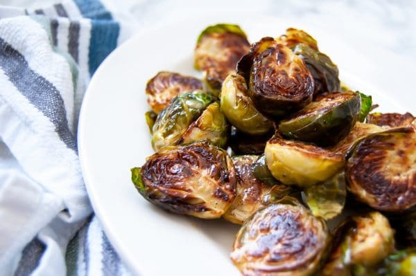 Maple dijon brussels sprouts are your answer to add flavor to easy roasted brussels sprouts. Try this easy, healthy side dish recipe today!