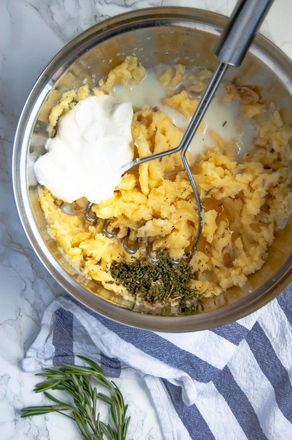 Greek yogurt mashed potatoes are a lighter mashed potato recipe that are packed with flavor. They're your perfect go-to homemade mashed potato recipe, even for Thanksgiving!