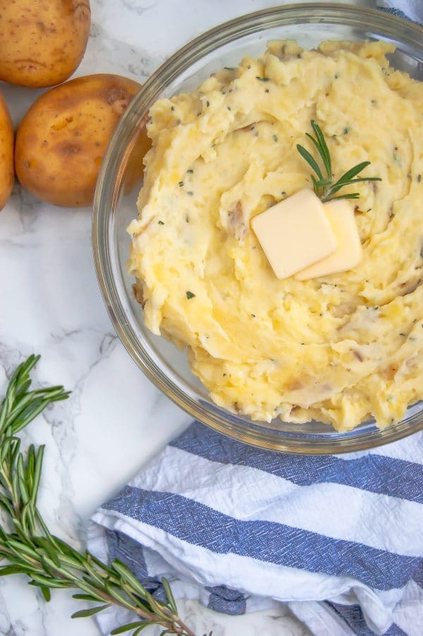 Greek yogurt mashed potatoes are a lighter mashed potato recipe that are packed with flavor. They're your perfect go-to homemade mashed potato recipe, even for Thanksgiving!