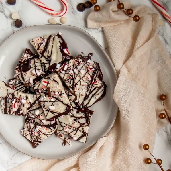 This triple chocolate peppermint bark is a delicious holiday treat, perfect for enjoying with family or giving as an edible holiday gift to loved ones!