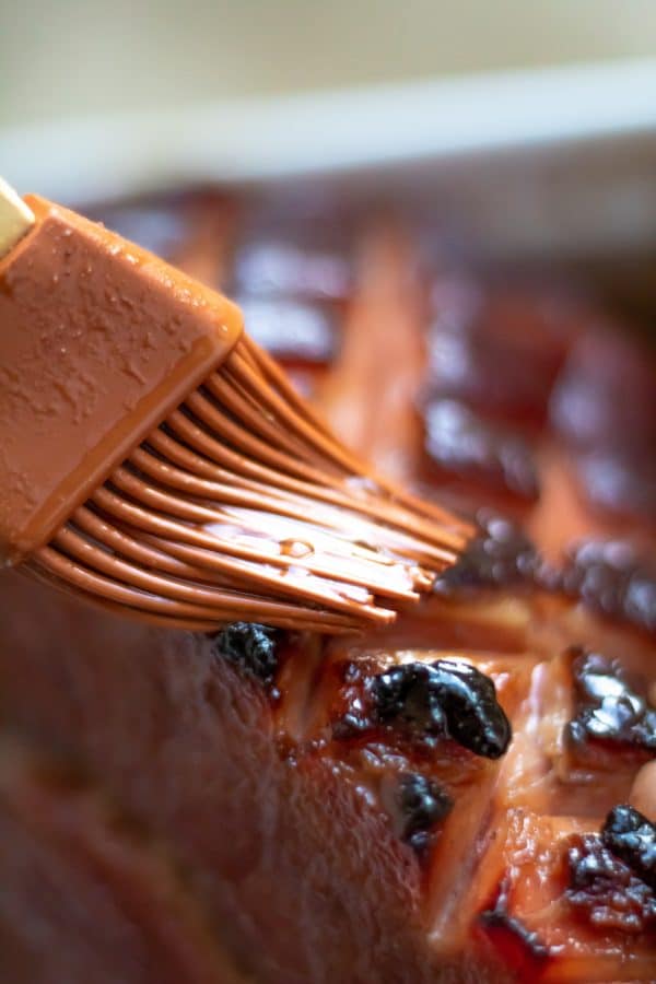 This pomegranate maple glazed ham has a glaze with no refined sugars and a balance of sweet, salty, and a little tang! Perfect for your holiday centerpiece!