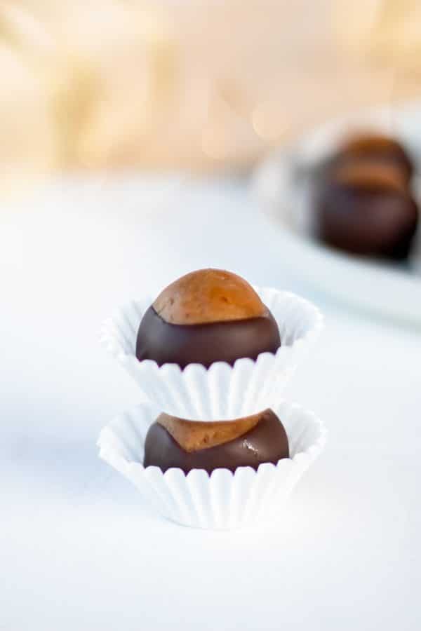 Two healthy buckeyes in mini muffin paper cups stacked on top of each other.