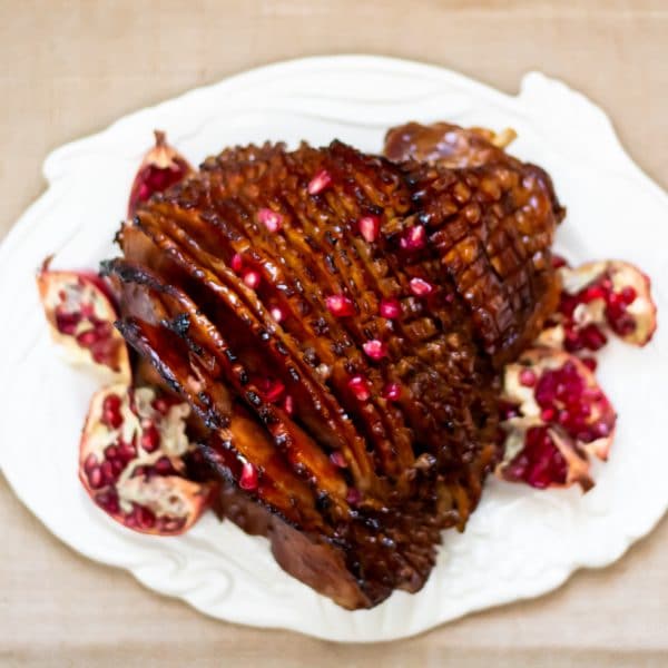 This pomegranate maple glazed ham has a glaze with no refined sugars and a balance of sweet, salty, and a little tang! Perfect for your holiday centerpiece!