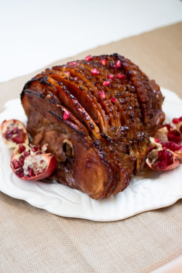 This pomegranate maple glazed ham has a glaze with no refined sugars and a balance of sweet, salty, and a little tang! Perfect for your holiday centerpiece!