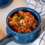 Blue crock of beanless chili with beef and vegetables