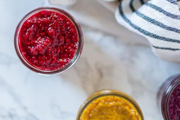 overhead shot of 3 jars of chia jam in red, yellow, and purple