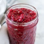 a mason jar of ruby red raspberry chia jam