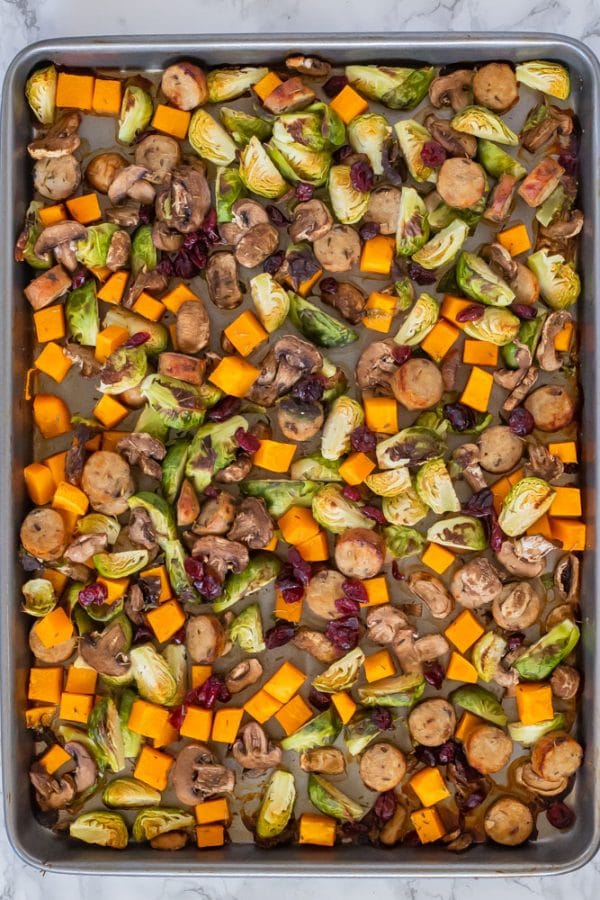 autumn chicken sausage sheet pan dinner on a sheet pan