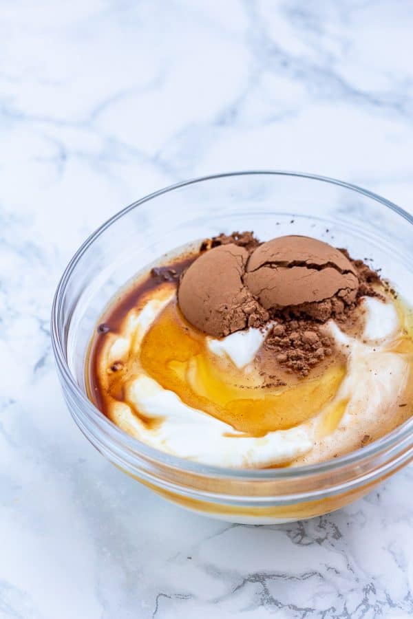 ingredients for chocolate yogurt in a mixing bowl