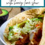 A picture with text overlay of blackened cod tacos with honey lime slaw