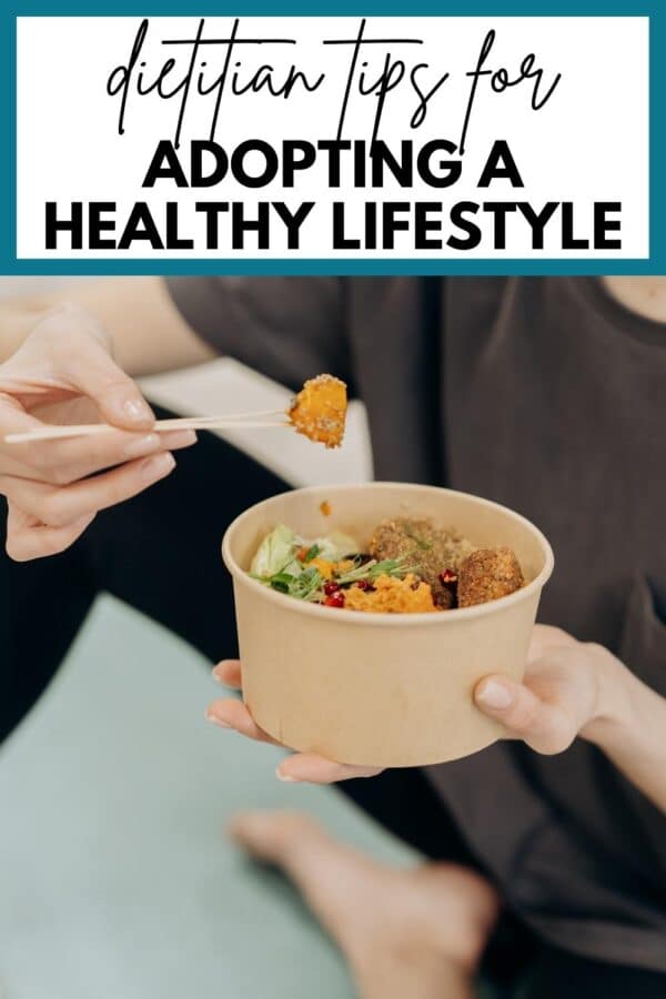 a woman eating a nourishing bowl of food with text overlay that reads, "dietitian tips for adopting a healthy lifestyle"