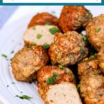 Turkey meatballs on a white plate garnished with fresh parsley