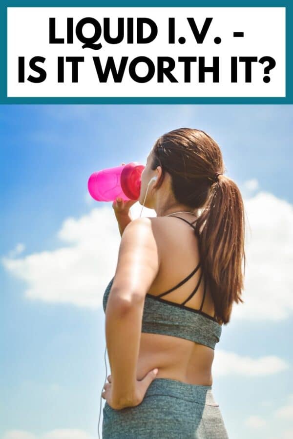 the back of a woman working out drinking from a pink shaker cup