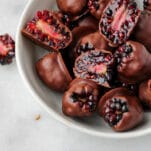 chocolate covered blackberries in a white bowl