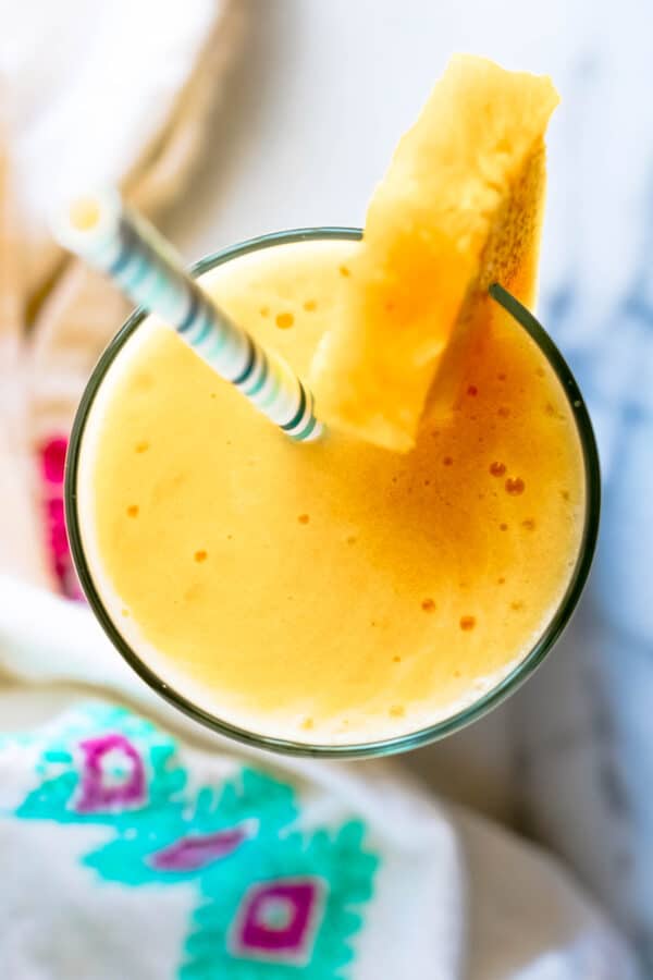 a glass of pineapple slushy