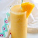 a tall glass of pineapple slushy