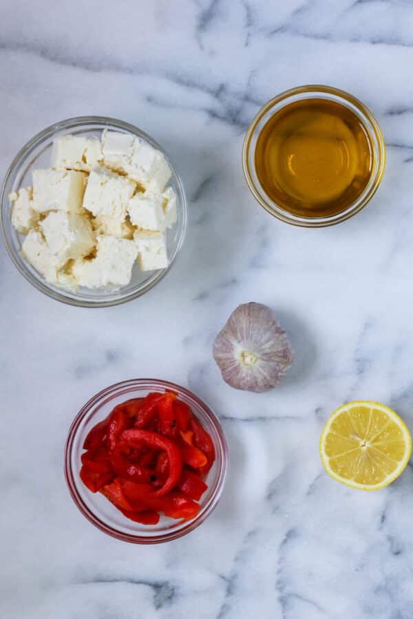 Ingredients to make red pepper feta dip (htipiti)
