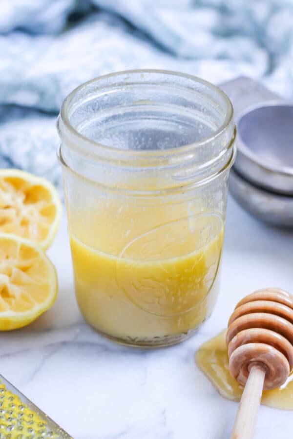 A small jar of lemon honey dressing