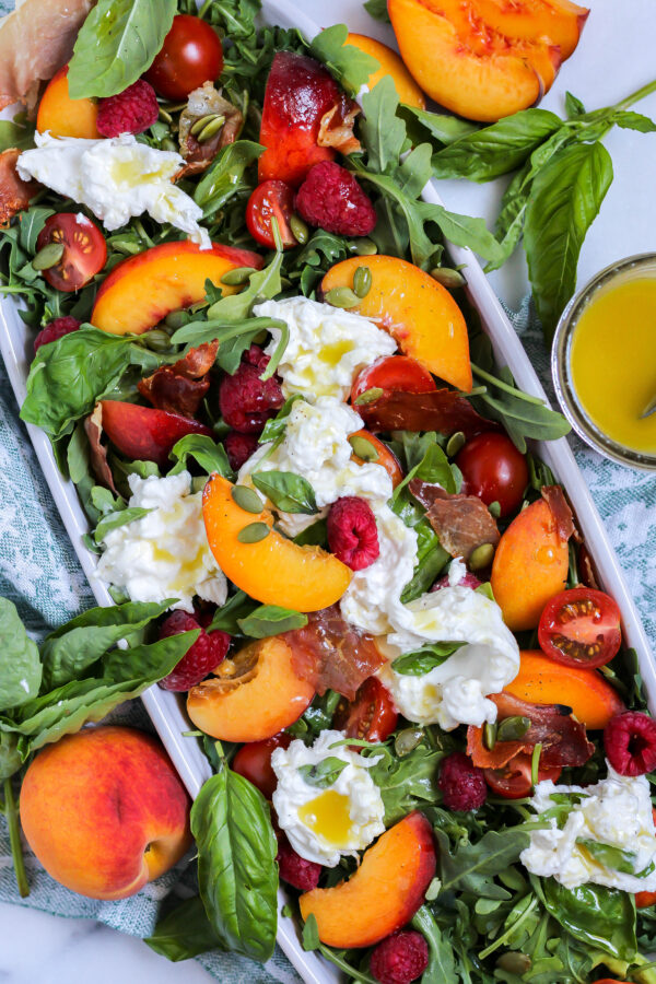 peach burrata salad with arugula, basil, and crispy prosciutto