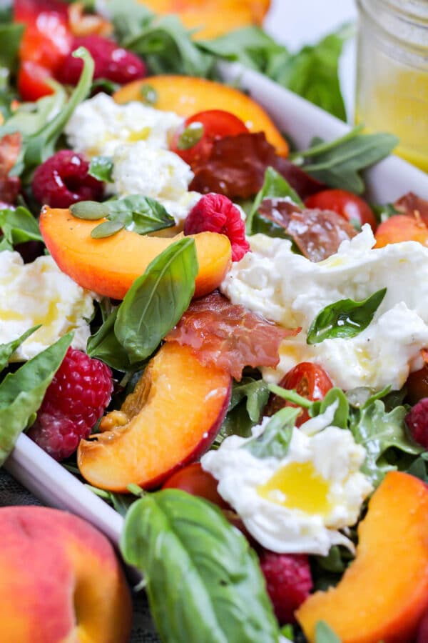 close up of peach burrata salad ingredients