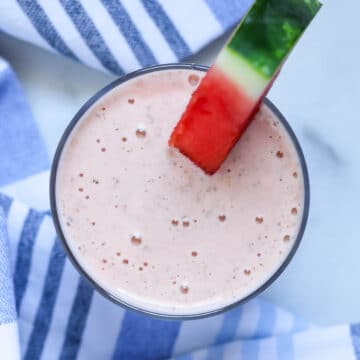 overhead view of a creamy light pink watermelon banana smoothie