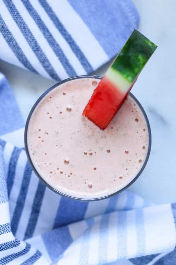 overhead view of a creamy light pink watermelon banana smoothie