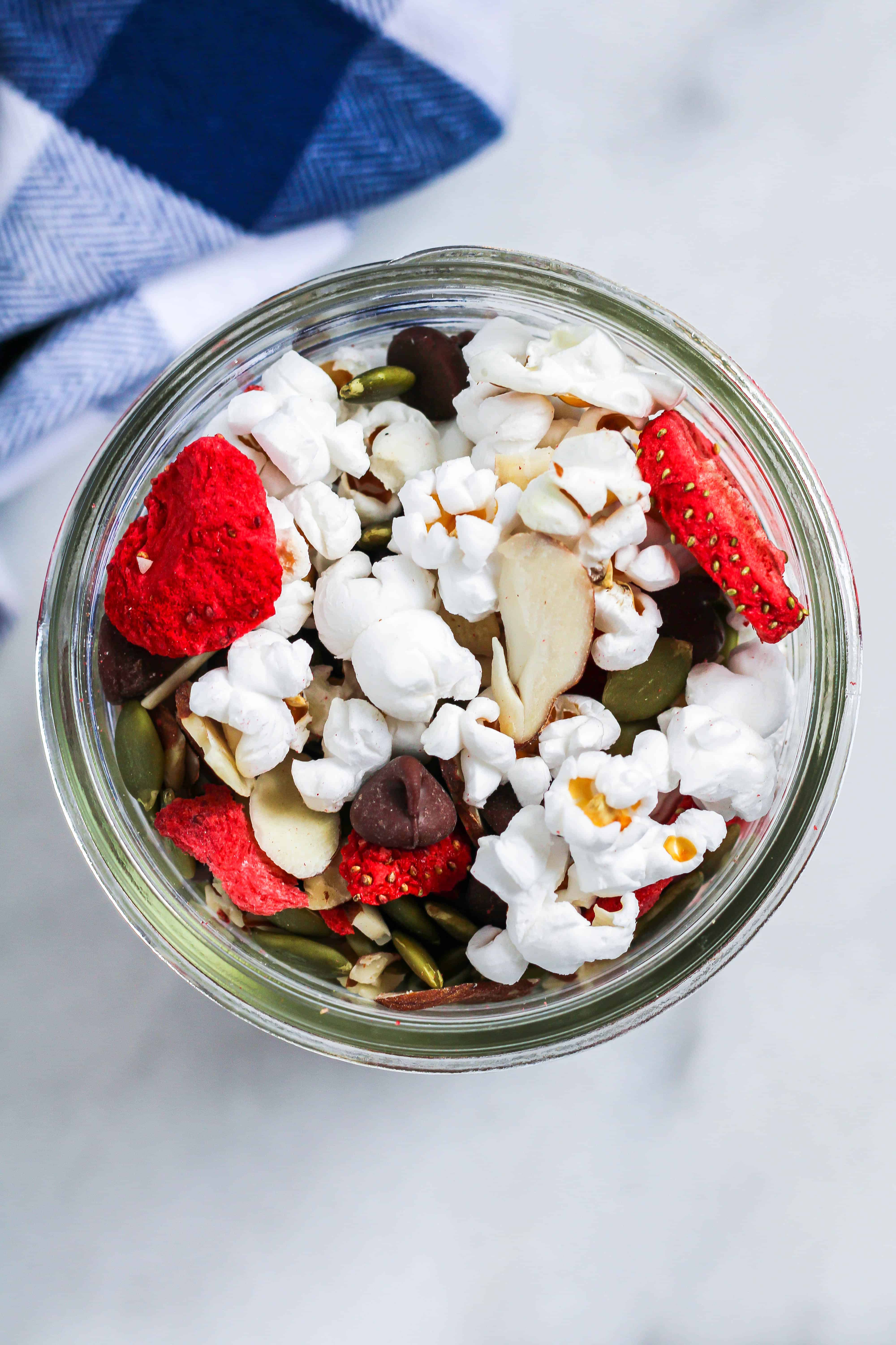 popcorn trail mix with freeze dried strawberries, almonds, pumpkin seeds, and chocolate chips