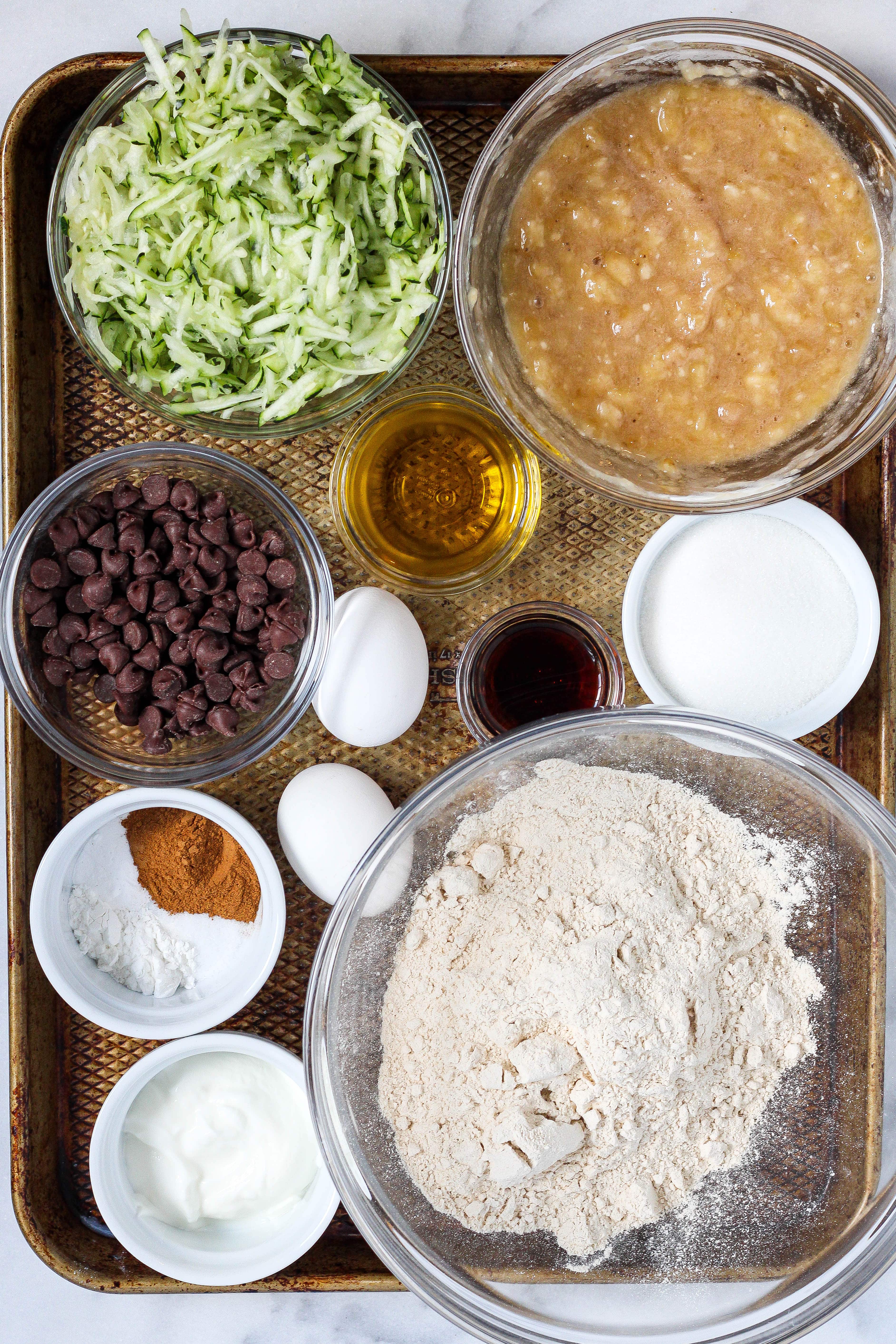 ingredients to make zucchini banana muffins with chocolate chips