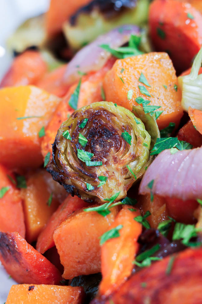 a caramelized brussels sprout in maple miso roasted vegetables