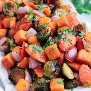 a platter of miso roasted vegetables garnished with parsley