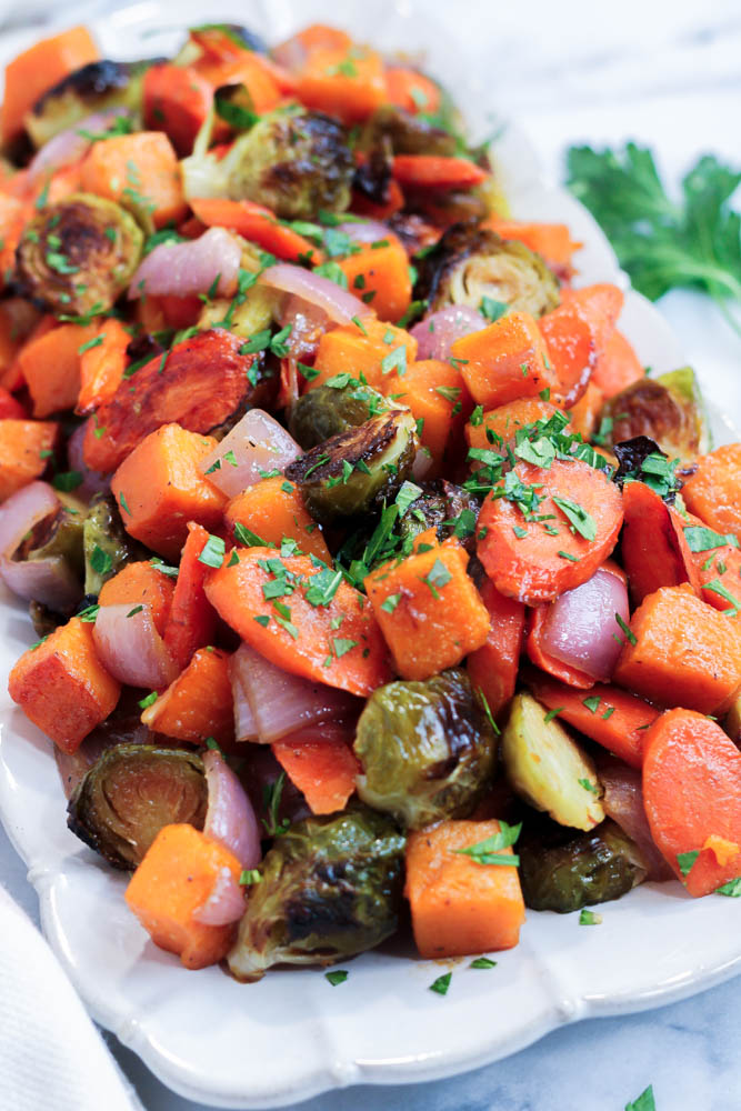 a platter of miso roasted vegetables garnished with parsley